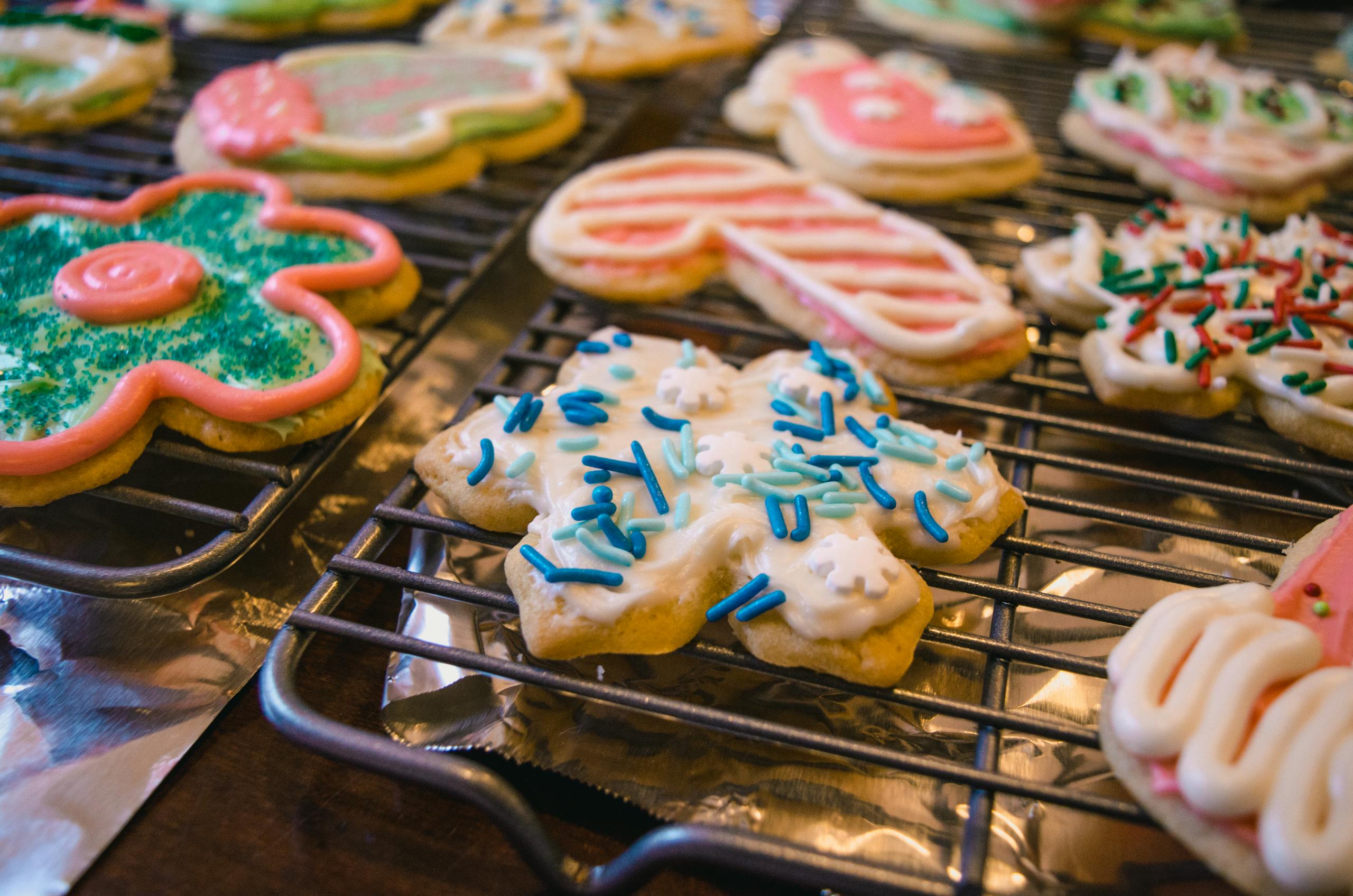 Deliciously decorated Christmas cookies cooling on a rack, perfect for the holiday season.